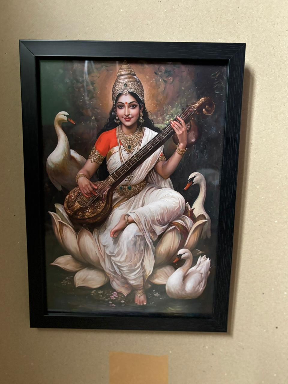 Saraswathi Devi Photo Frame | Goddess of Knowledge & Wisdom Wall Art | 300 GSM Glossy Laminated Artboard | Vastu Decorative Gift for Students & Homes